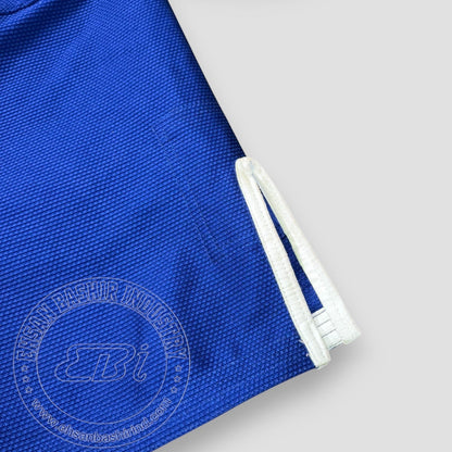 Ehsan Bashir Industry blue cotton Jiu Jitsu Gi with reinforced stitching and white trim.