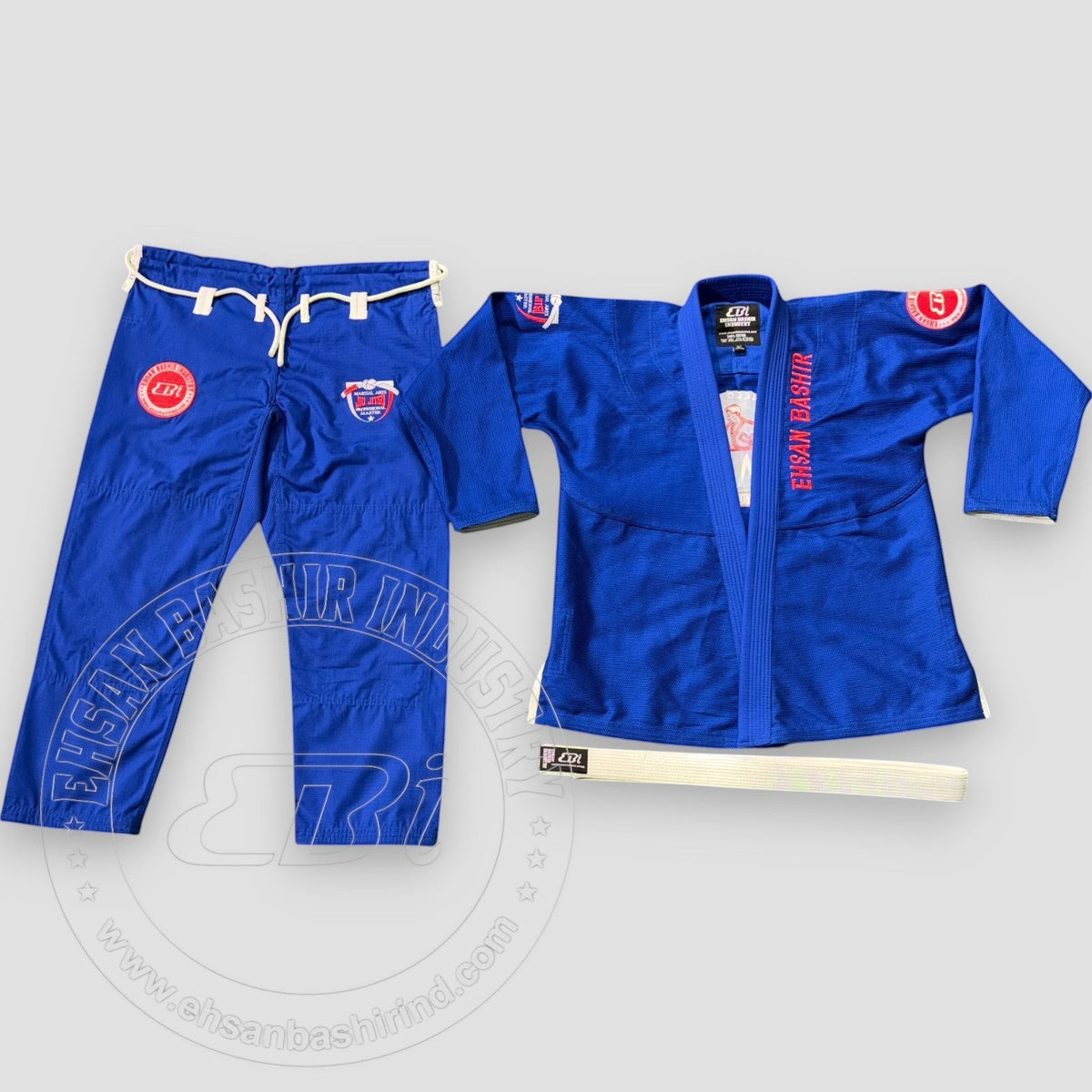 Ehsan Bashir Industry blue cotton Jiu Jitsu uniform Gi with white belt. Features reinforced stitching and branding.