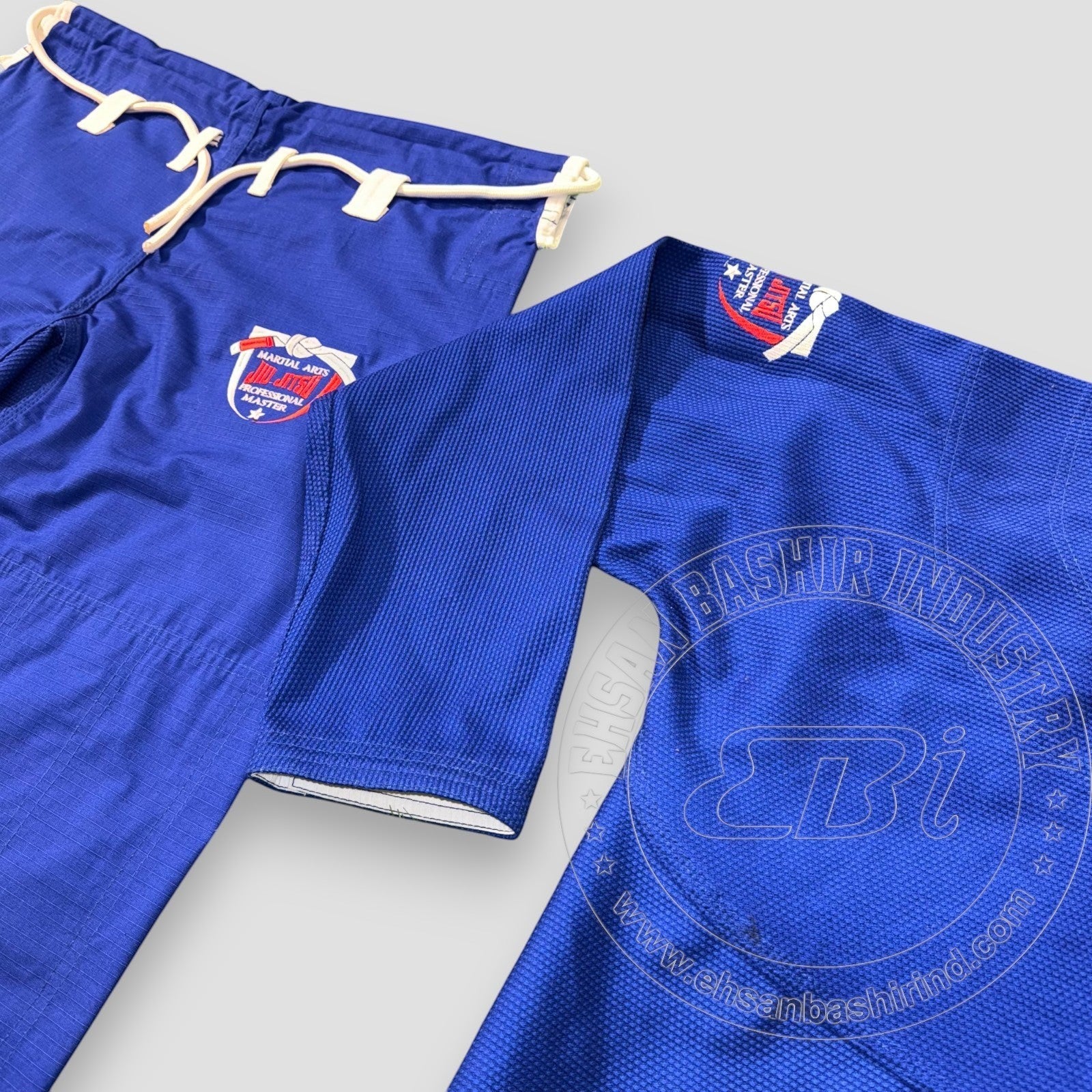Ehsan Bashir Industry blue cotton Jiu Jitsu uniform Gi with reinforced stitching and embroidered logo. Includes drawstring pants.