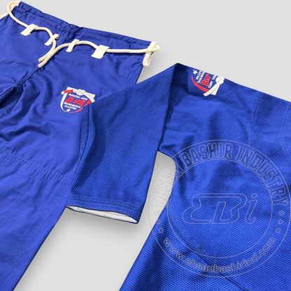Ehsan Bashir Industry blue cotton Jiu Jitsu uniform Gi with reinforced stitching and embroidered logo. Includes drawstring pants.